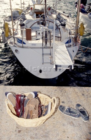 Shoes in a basket on the dockside