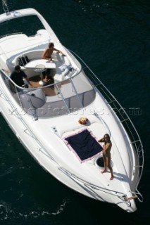 A topless woman on a boat