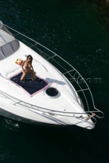 Topless woman on a boat