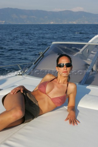 Topless woman on a boat