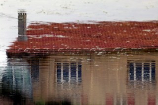 Colourful reflections in water of buildings and architecture in southern France