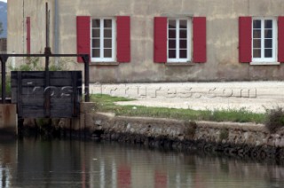 Colourful reflections in water of buildings and architecture in southern France