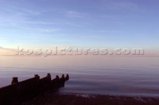 Breakwater on a still day  Whitstable Beach Kent