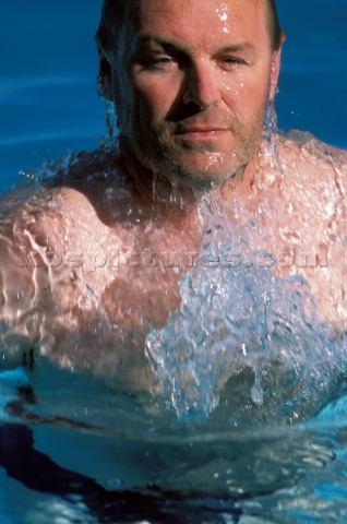 Man breaking through surface of water