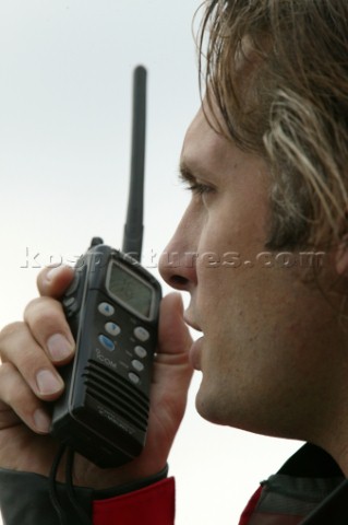 Man using an ICOM VHF handheld radio