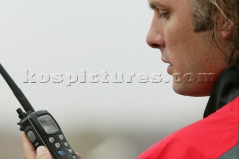 Man using an ICOM VHF handheld radio