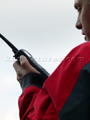 Man using an ICOM VHF handheld radio