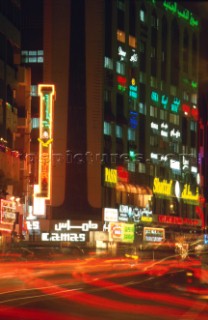 Bright city lights at night, Dubai - United Arab Emirates.