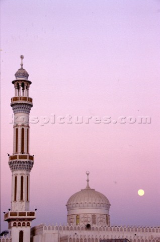 Tower of mosque at sunset Dubai  United Arab Emirates