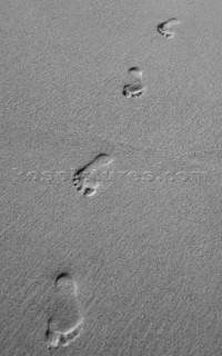 Footprints in sand.