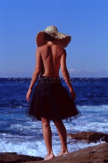 Girl in Hat on rock, Austrlia