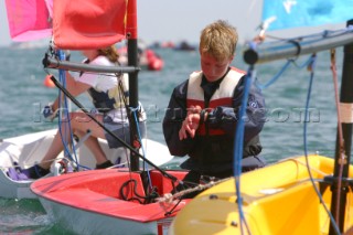 Boy checks his watch as he prepares for racing