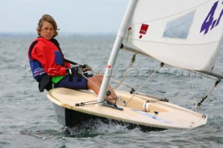 Young girl sailing Laser