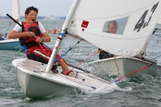 Boys racing Laser dinghies