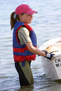 Young girl standing in shallow water