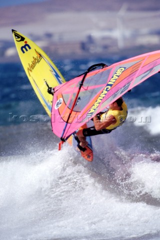 Windsurfer jumping off wave