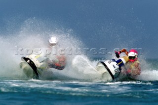 Two Jet Ski riders turning sharply during race