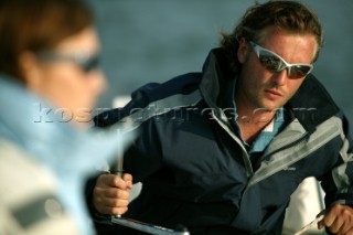 Crew member wearing Henri Lloyd jacket grinding winch