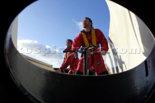 Maxi Catamaran Cheyenne on a 24 hour charge from Plymouth to Antwerp for loading on a ship to the Middle East. Crew grinding coffee grinder winches.