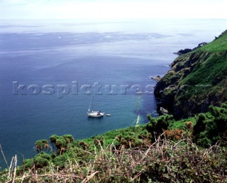 Boat anchored off Starehole Cove near Salcombe, South Devon