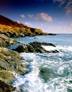 Waves breaking over rocks at Limebury Point, Salcombe Estuary, South Devon