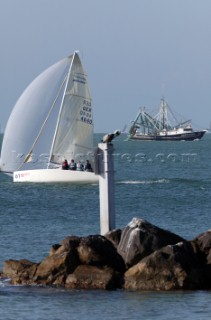 Melges 24 passing shrimp fishing trawler and rocks at Key West Race Week 2005