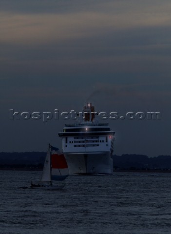 PO cruise ship Aurora with navigation lights at night turning sharply to avoid collision with a smal