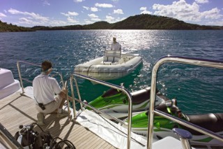 Tender approaching anchored superyacht