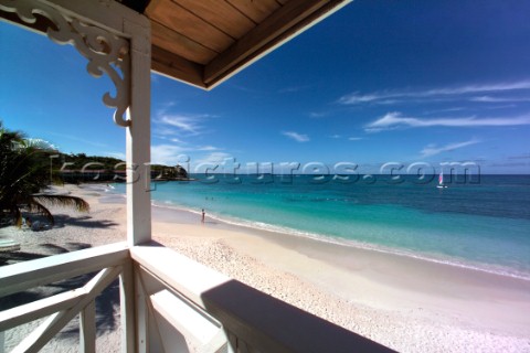 Shelter of wooden hut on idyllic tropical beach