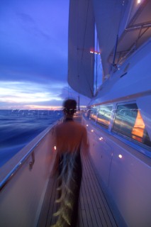 Guest on superyacht in evening dress