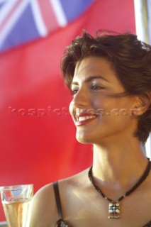 Close up of woman drinking champagne on superyacht