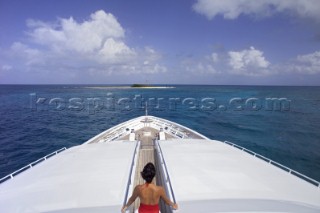 Woman on top deck of superyacht