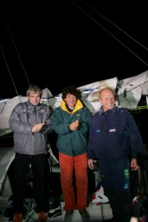 Congratulated by winner Vincent Riou of PRB and Jean Le Cam of Bonduelle, British Open 60 sailor Mike Golding of Ecover arriving in Les Sables dOlonne at the end of the Vendee Globe 2004/2005