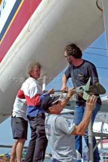 Crewmen Herve Jan, Mark Featherstone, Gerard Navarin taking out propeller Cheyenne