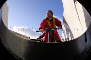 Maxi Catamaran Cheyenne on a 24 hour charge from Plymouth to Antwerp for loading on a ship to the Middle East. Crew grinding coffee grinder winches.