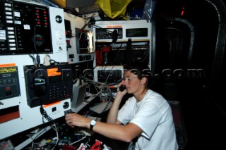 Claire Bailey at nav station during boat rewiring