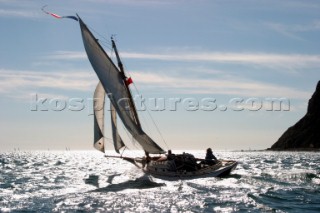 Gaff cutter sailing inshore