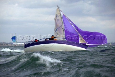 Purple J80 Just Savage in severe broach during a fast downwind run in Cowes Week 2004