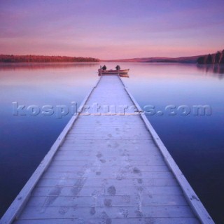 Footprints in frost on wooden jetty