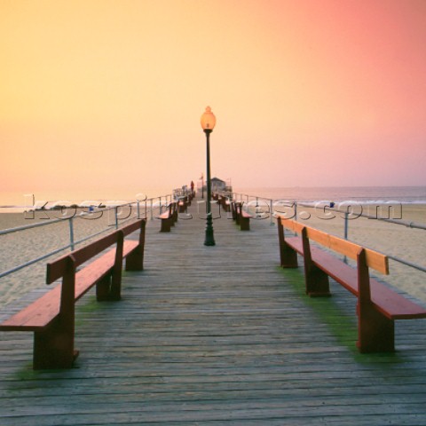 Benches and lampost on wooden pier