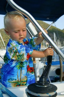 Young child playing with winch handle