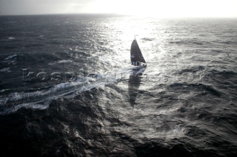 Vendee Globe Open 60 yacht Hugo Boss skippered by Alex Thomson sailing in rough water and strong bre
