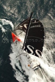 Open 60 Hugo Boss crashing through rough seas