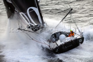 Vendee Globe Open 60 yacht Hugo Boss skippered by Alex Thomson crashing through rough seas in strong winds