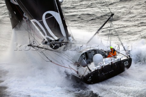 Vendee Globe Open 60 yacht Hugo Boss skippered by Alex Thomson crashing through rough seas in strong