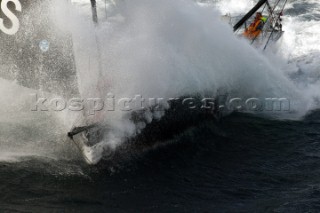 Vendee Globe Open 60 yacht Hugo Boss skippered by Alex Thomson crashing through rough seas in strong winds