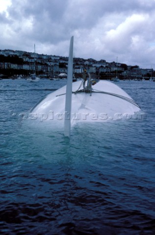 The Maxi yacht Drum owned by Simon Le Bon of Duran Duran lies upturned and capsized without its keel