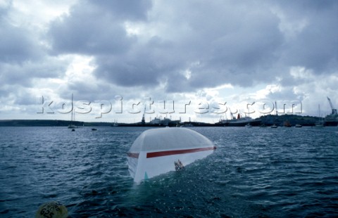 The Maxi yacht Drum owned by Simon Le Bon of Duran Duran lies upturned and capsized without its keel