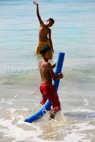 Tortola Island  British Virgin Islands   Cane Garden Bay  Local Children playing with the water