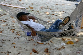 Jost Van Dyke Island - British Virgin Islands - The village of Great Harbour on Jost Van Dyke -Local Man sleeping on the hammock